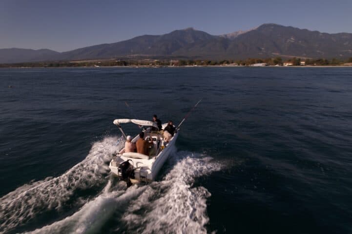 fishing in Gritsa from Prado Apartments motorboat on the Aegean Sea with Mount Olympus in the background