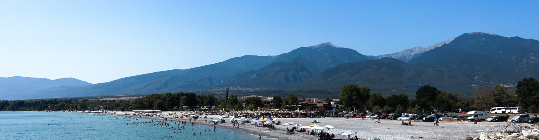 View of Gritsa Beach, a 50-meter wide stretch of coast located 200 meters from Prado Hotel, with Mount Olympus in the background