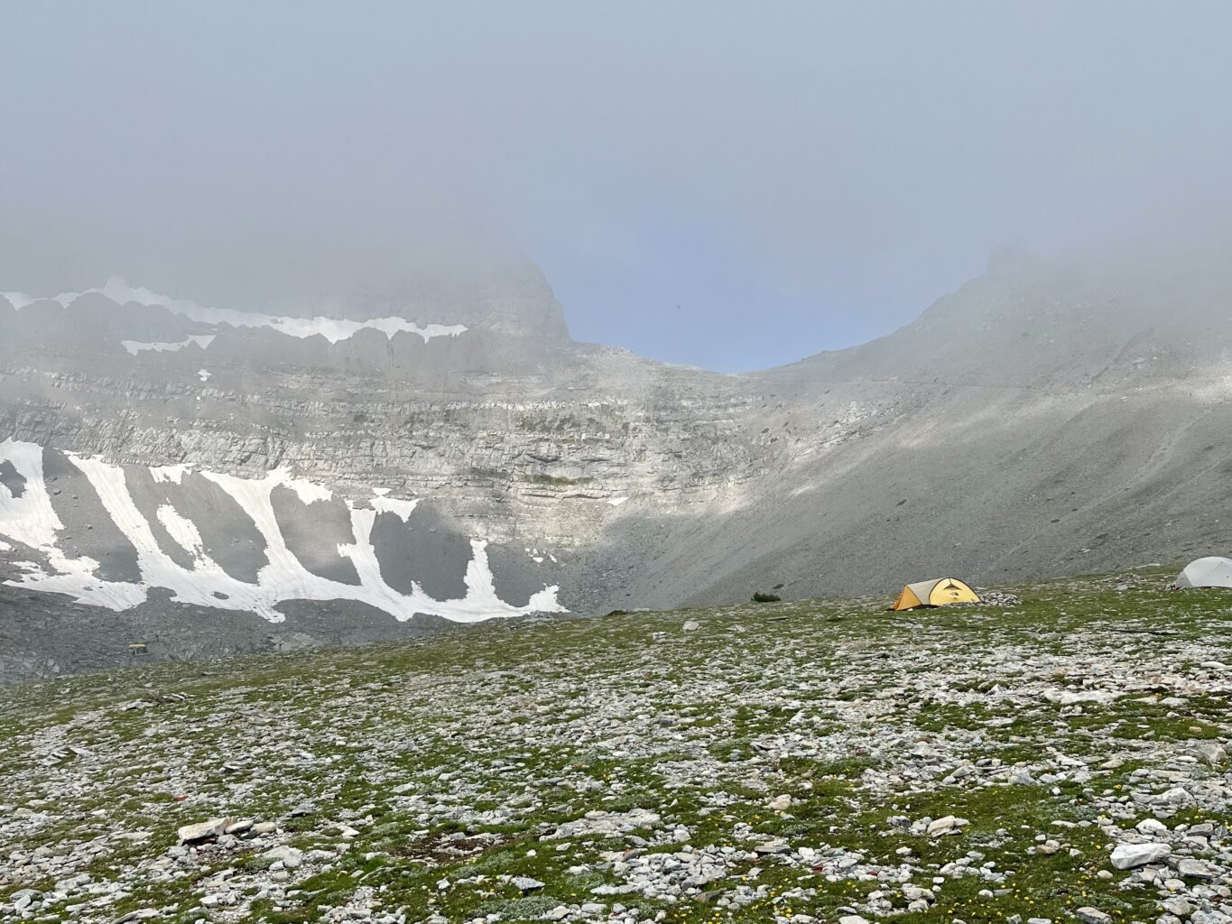 Mytikas area Mount Olympus in June summit plateau snow patches Greece hiking season