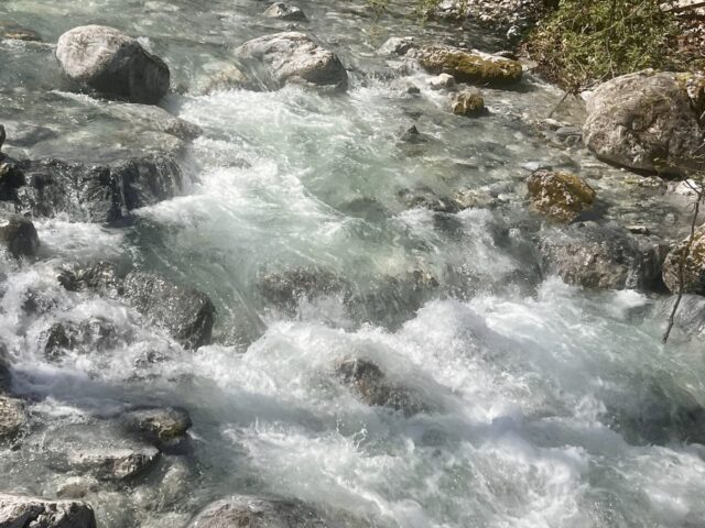 Crystal clear rapids of the Enipeas river flowing over rocks in the Enipeas Gorge, Litochoro