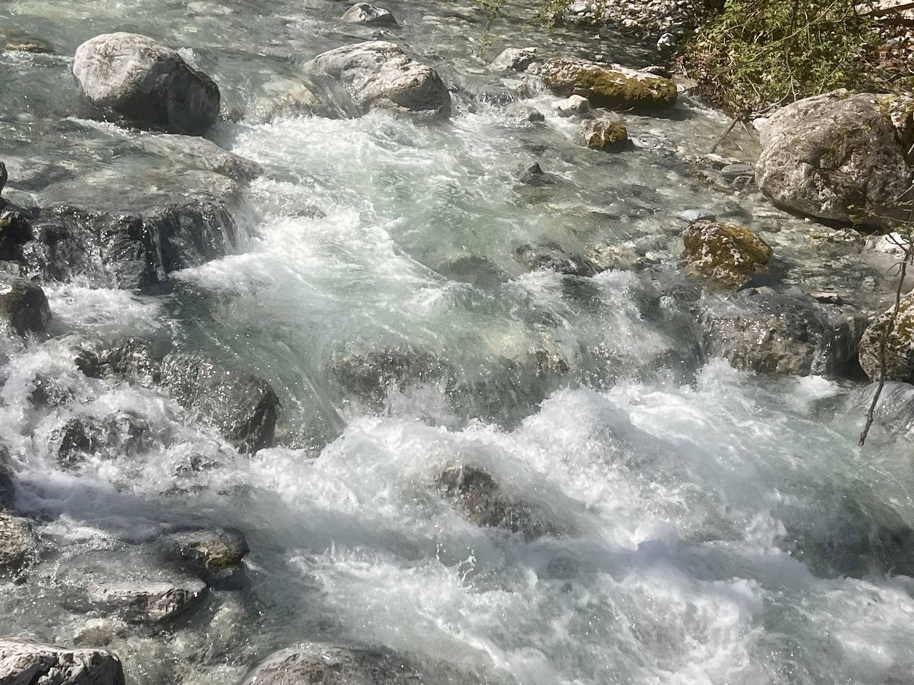 Crystal clear rapids of the Enipeas river flowing over rocks in the Enipeas Gorge, Litochoro