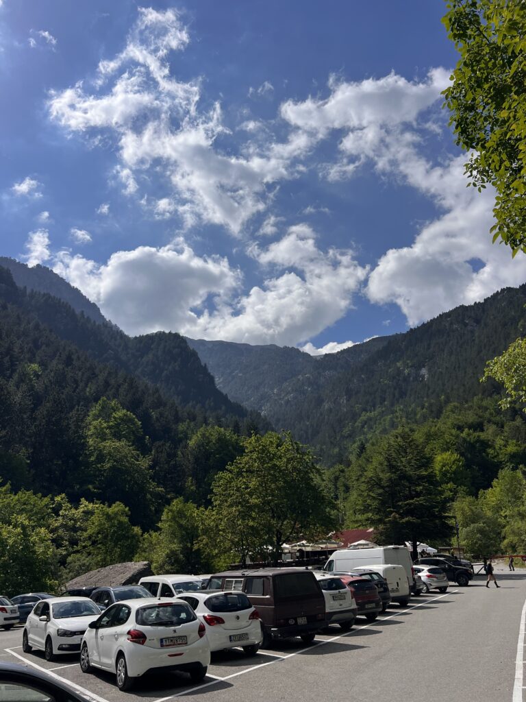Prionia trailhead parking lot at the start of the Mount Olympus hiking route, surrounded by forest